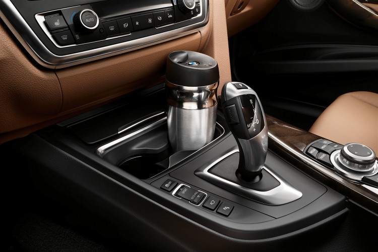 Gyroscopic, anti-spill cup holders exist and they’re from BMW