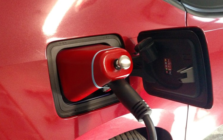 The finished product. I even found a BMW i Frozen Blue color rubber band. It's pretty amazing how well this cover fits the i3's charge port opening. It's almost as if it were designed purposely for this application.