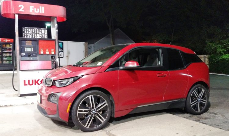 Even though the car actually has a 2.4 gallon gas tank, BMW restricted the amount of gas available to 1.9 gallons through software. Had they left the entire 2.4 gallons accessible, the range on gasoline would be slightly greater than the electric range, and therefore not qualify for the BEVx designation. 