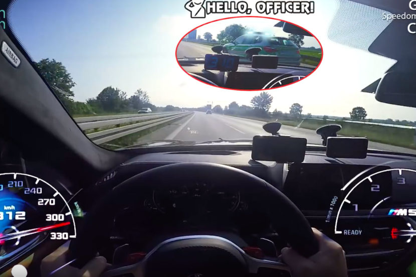 BMW F90 M5 flies past a police car on German Autobahn