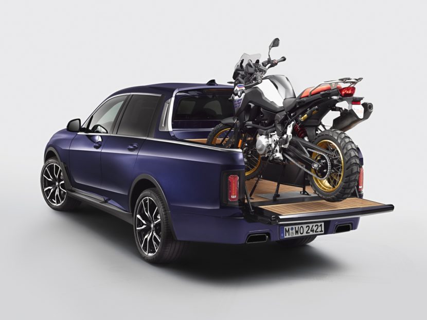 BMW X7 Pickup truck carrying a BMW motorcycle