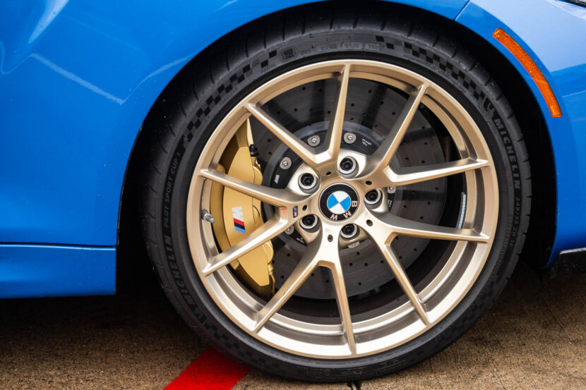 Close-up of Misano Blue BMW M2 CS with carbon ceramic brakes