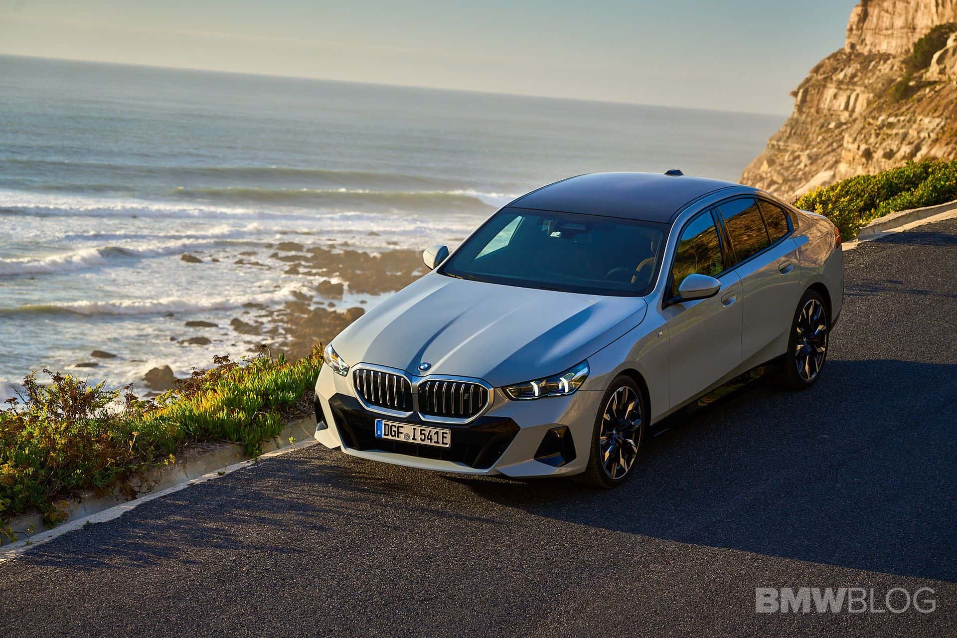 BMW i5 filmed by the ocean