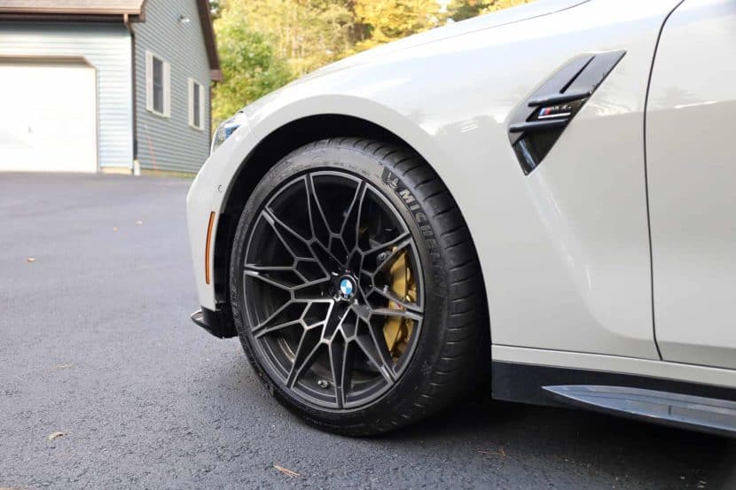 BMW M4 Competition in Chalk with gold carbon ceramic brakes and 19-inch wheels