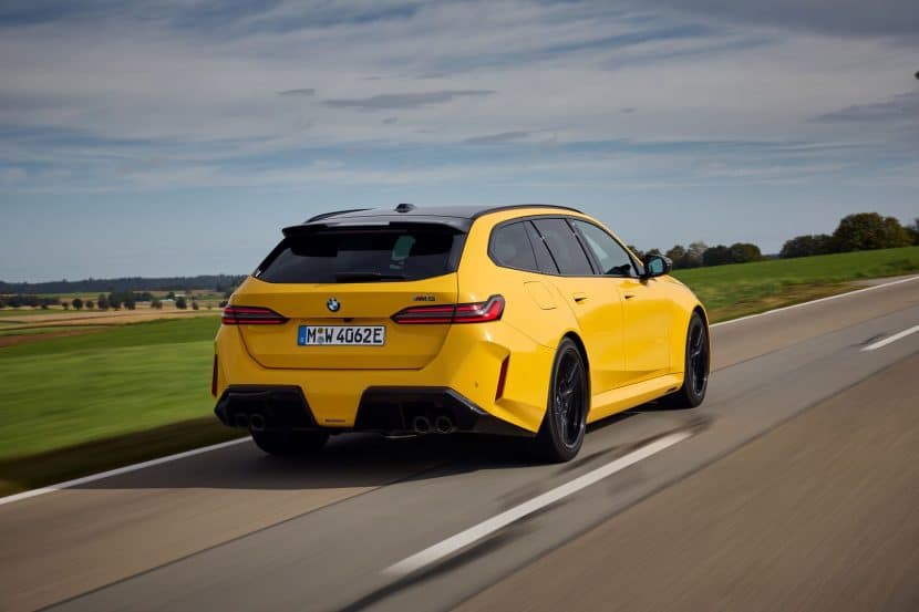 2025 BMW M5 Touring Speed Yellow rear three-quarter view
