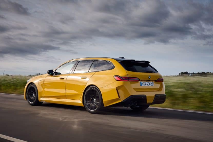 BMW M5 Touring rear three quarter view on the road