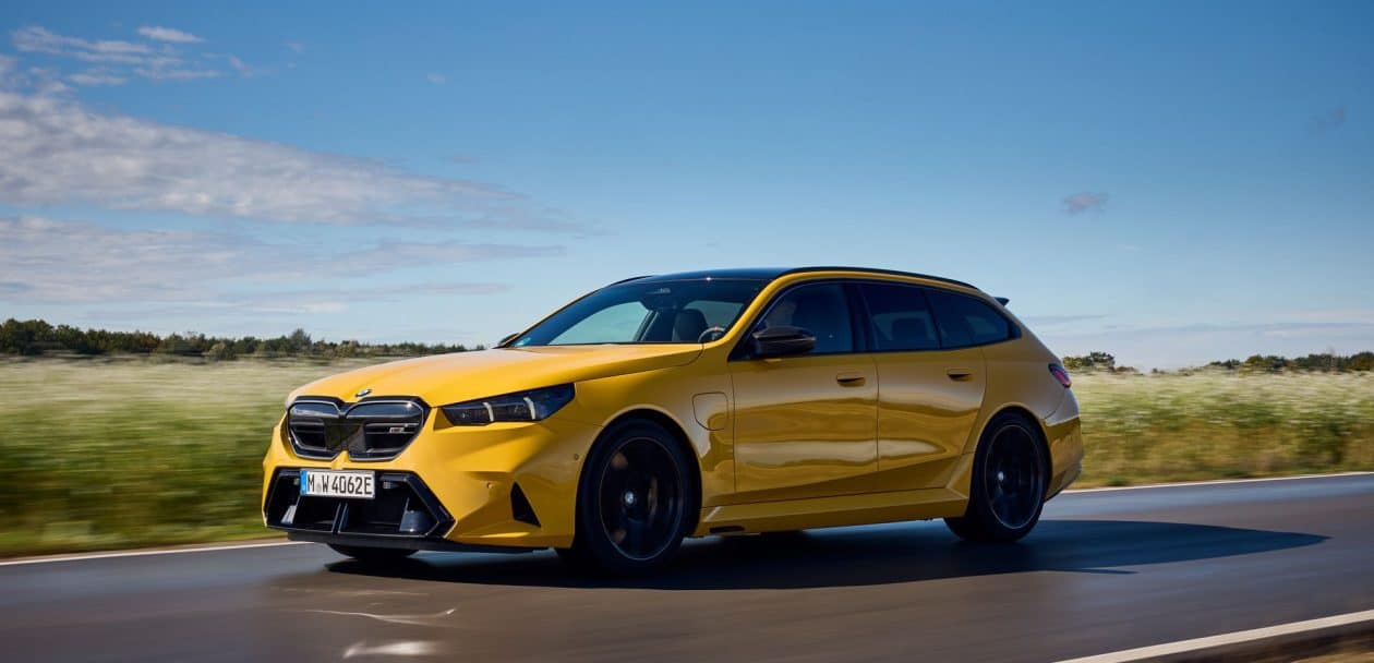 2025 BMW M5 Touring Speed Yellow front three-quarter view