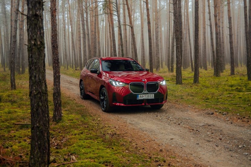 BMW X3 M50-127 BMW X3 M50 in Fire Red in the woods