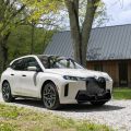 2026 BMW iX xDrive45 front three-quarter view with 21-inch wheels