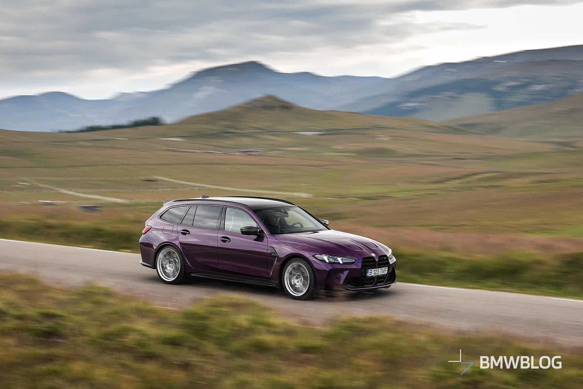BMW M3 Touring Competition in Twilight Purple driving through Romanian mountain roads