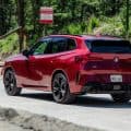 2025 BMW X3 M50 FIRE RED three quarter rear-end