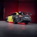BMW M2 Track Package prototype with large rear wing and camouflaged rear spoiler