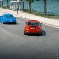 BMW 1M VS PORSCHE CAYMAN GTS DRIVING BY THE LAKE