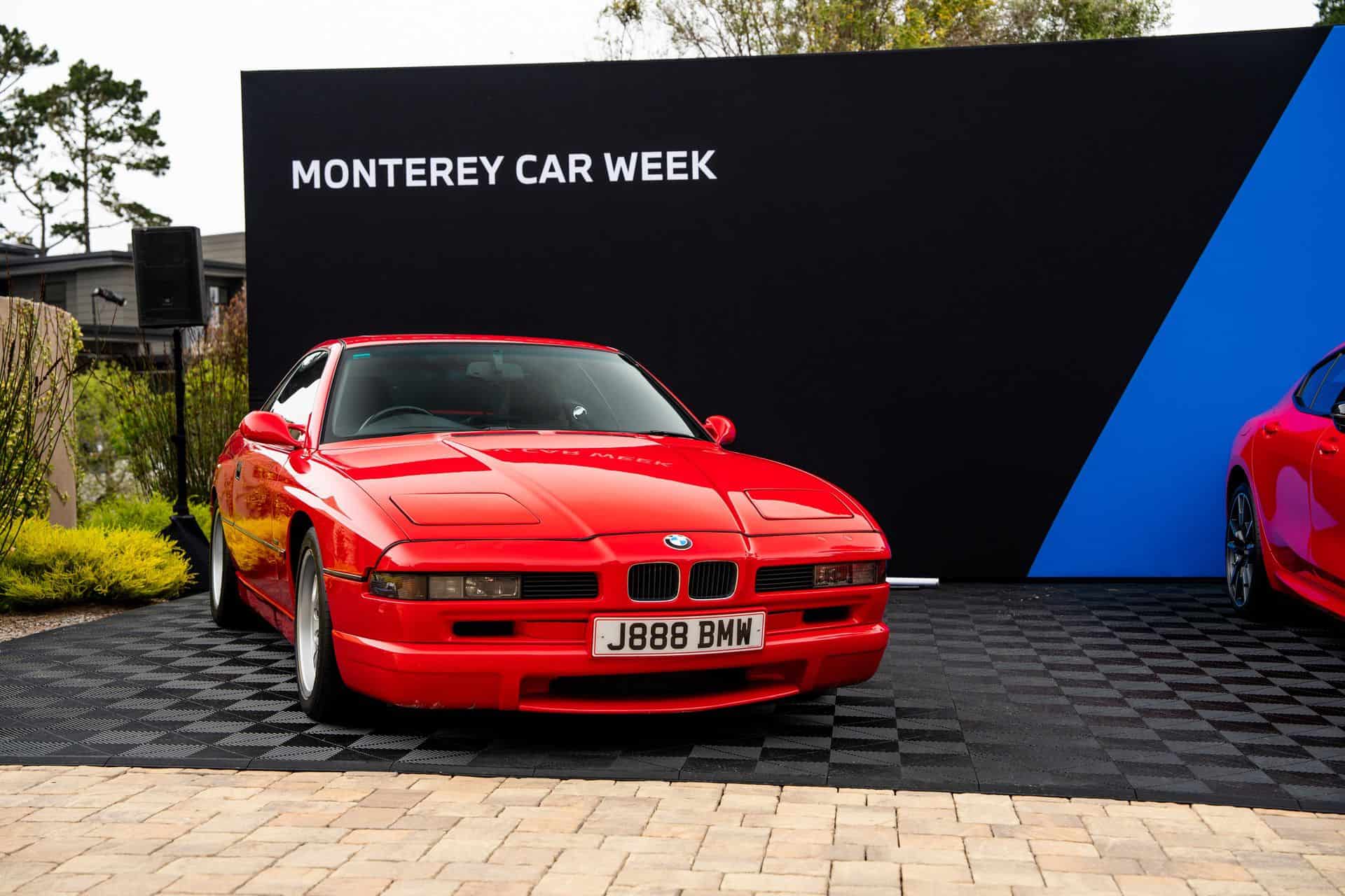 Japan-spec right-hand drive BMW 850CSi in Bright Red next to 2026 M850i Heritage Edition at Pebble Beach