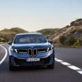 2026 BMW IX3 driving on the road