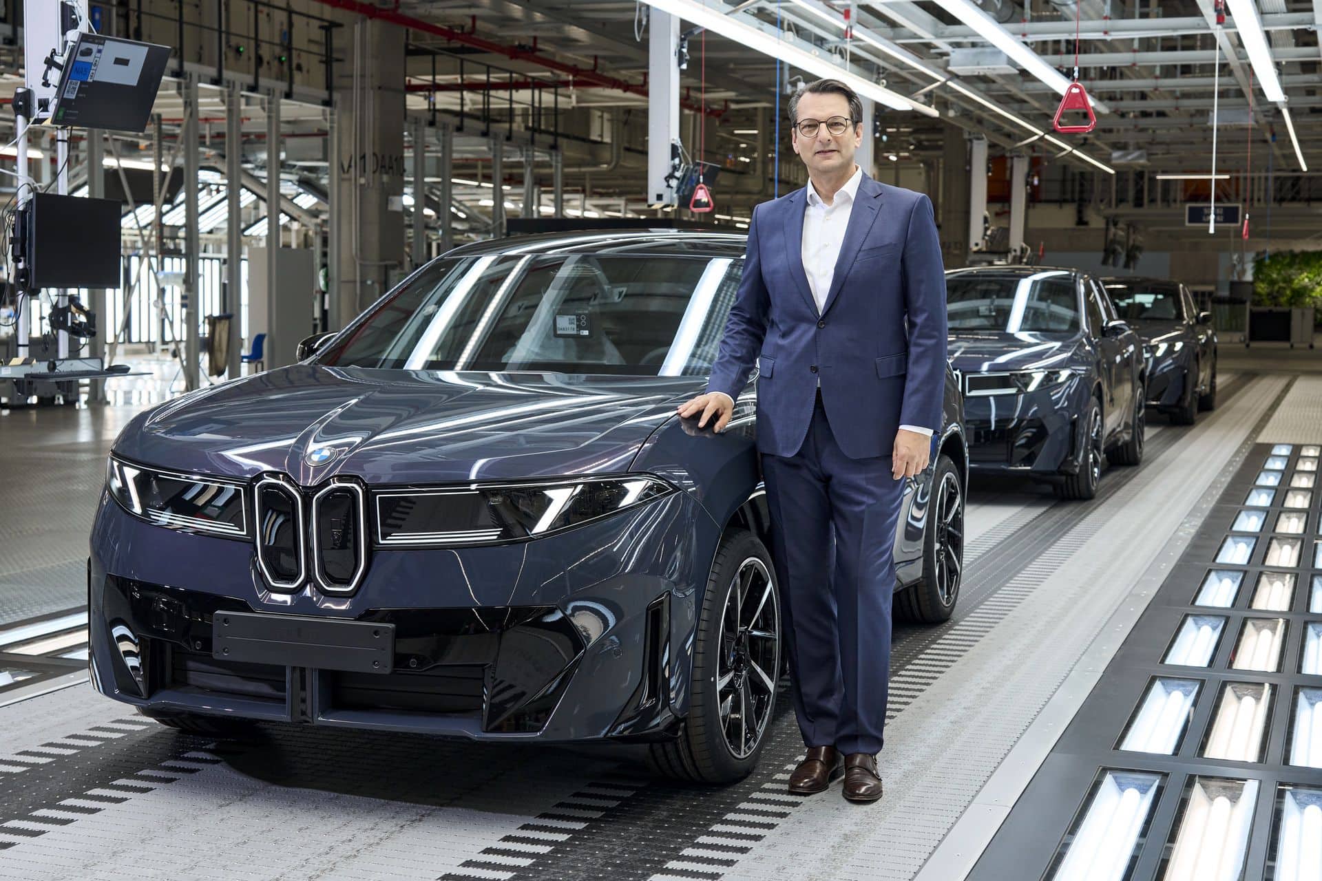 BMW Board Member Dr. Milan Nedeljkovic and a BMW iX3 production vehicle on assembly line in Debrecen