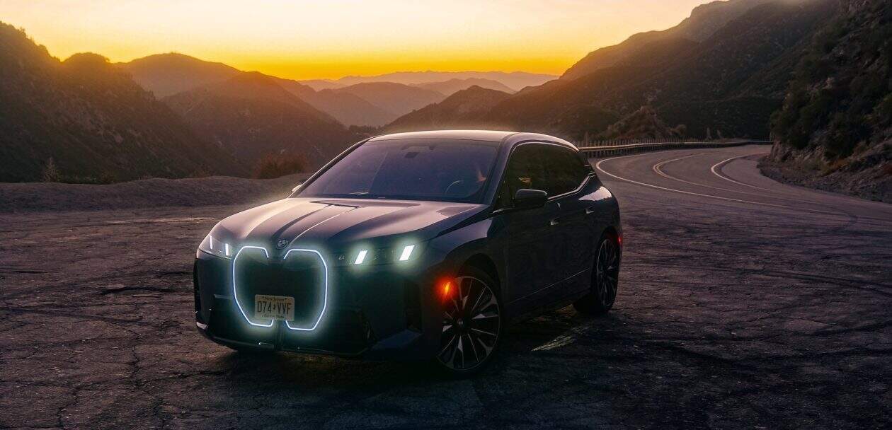 2026 BMW IX M70 with glowing headlights