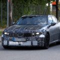 2028 BMW M3 G84 prototype with plastic camouflage and widened fenders