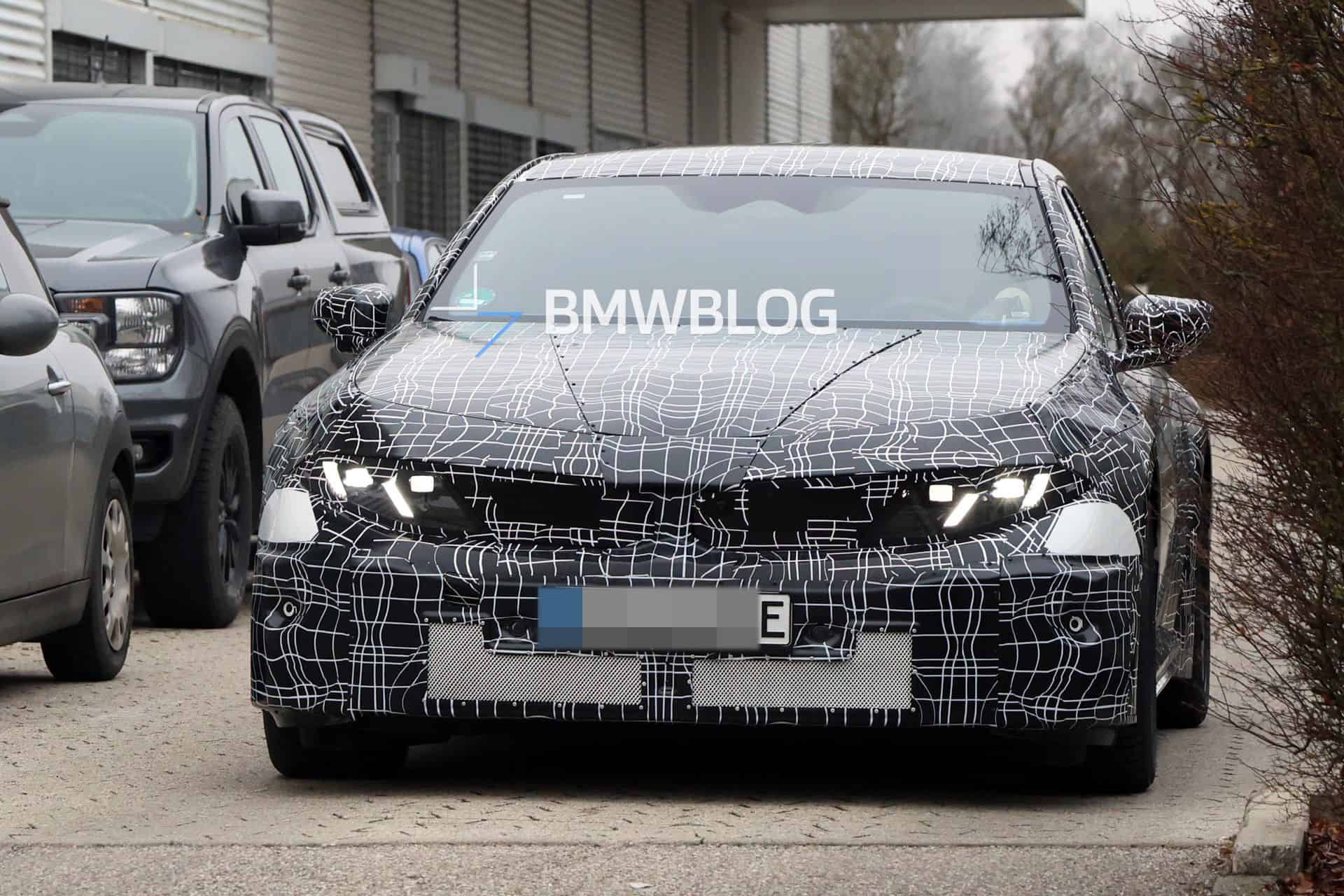 2027 BMW M3 ZA0 electric prototype spotted testing with production-ready Neue Klasse headlights featuring dual slanted LED elements