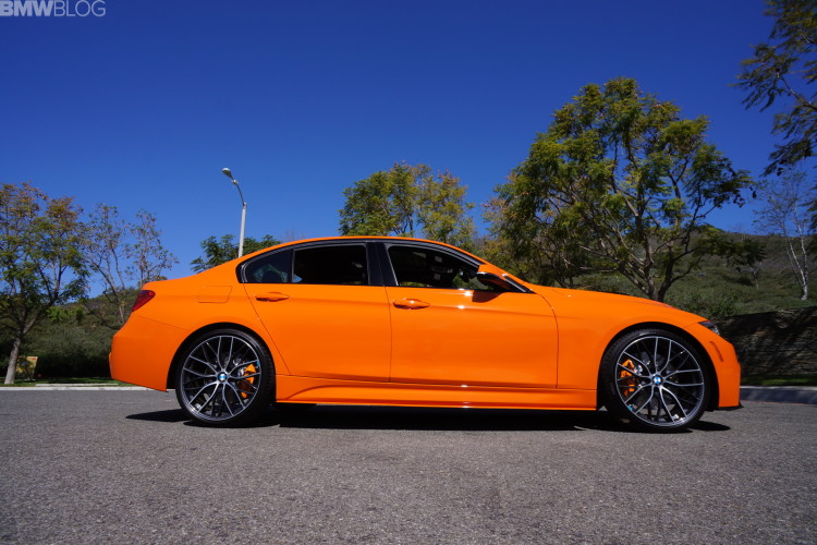 Fire Orange BMW 335i with manual transmission